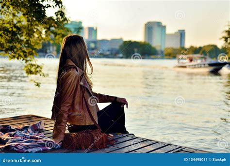 Cute Girl Sitting On The Pier In The Fall At Sunset Stock Image Image Of Blond Person 134495011