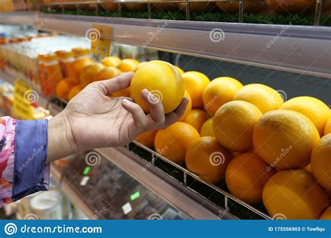 Woman Hand Choosing An Orange At Supermarket Stock Image Image Of