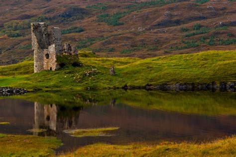 Ardvreck castle sits on a sliver of land jutting out into loch assynt. Ardvreck Castle landscape print | David Ross Photography