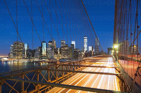 Illuminated Brooklyn Bridge At Night Stock Photo