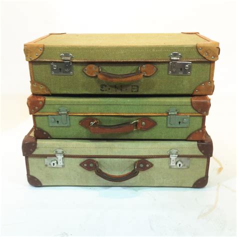 Stack Of 3 Green Vintage Canvas Suitcases 20th Century Props