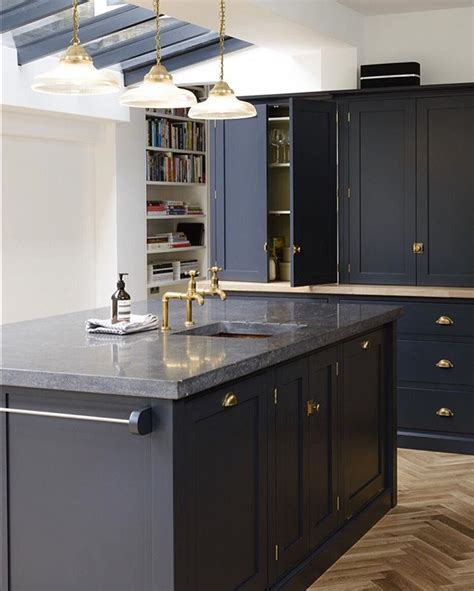 Dark blue cabinets with white countertops with subway tile as. These dark Belgian blue limestone worktops look so cool ...