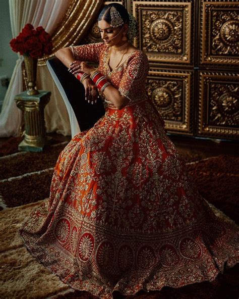 Nri Brides Spotted Wearing The Most Exquisite Bridal Lehengas Bridal Lehenga Red Bridal