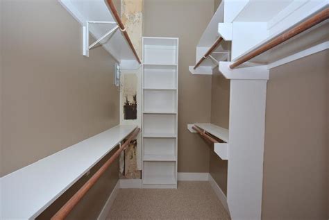 Both closet rods and shelves must be of high quality. A partial view of the large walk-in closet features double ...