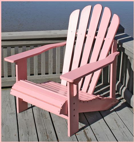 He was desperately seeking a comfortable piece of furniture to sit in while he enjoyed. ~PINK ADIRONDACK CHAIRS ARE COOL~