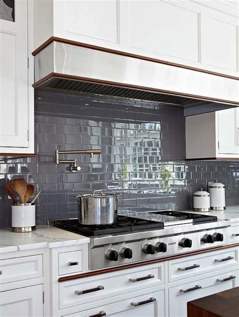 This trendy tile is easily customizable:. Dark gray subway tiles continue throughout a kitchen ...
