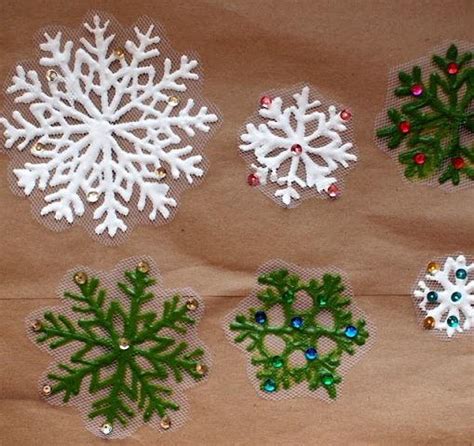 And now the leaves are ready to be stuck to the windows! Glistening Snowflake DIY Window Clings | AllFreeChristmasCrafts.com