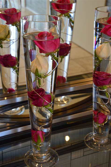 Flower displays in water | Cheap wedding table centerpieces, Wedding