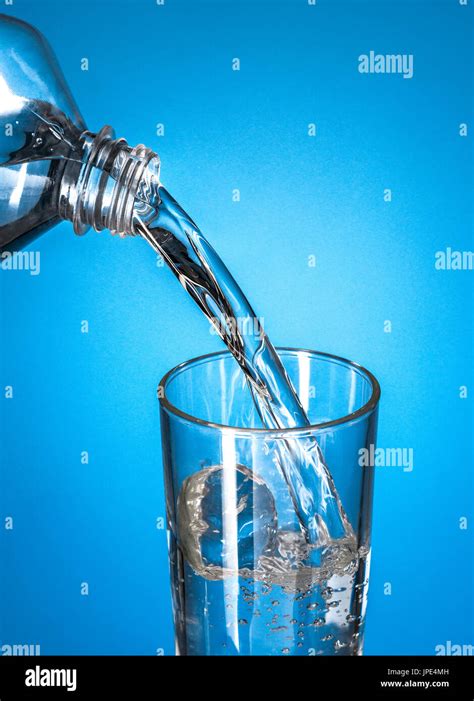 Pouring Water In Transparent Crystal Glass Hi Res Stock Photography And