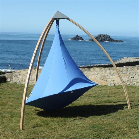 A revolutionary luxury style hammock shaped like a space capsule that can be hung indoors or. The Double Hanging Chair by Cacoon