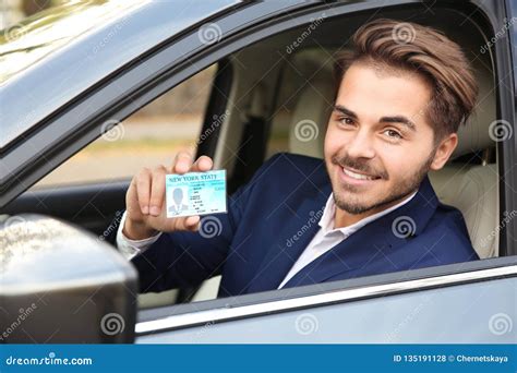 Young Man Holding Driving License Stock Photo Image Of License