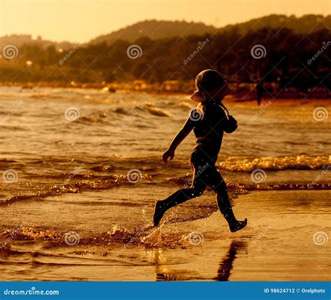 Girl Running On Beach At Sunset Stock Photo Image Of Ocean Sand