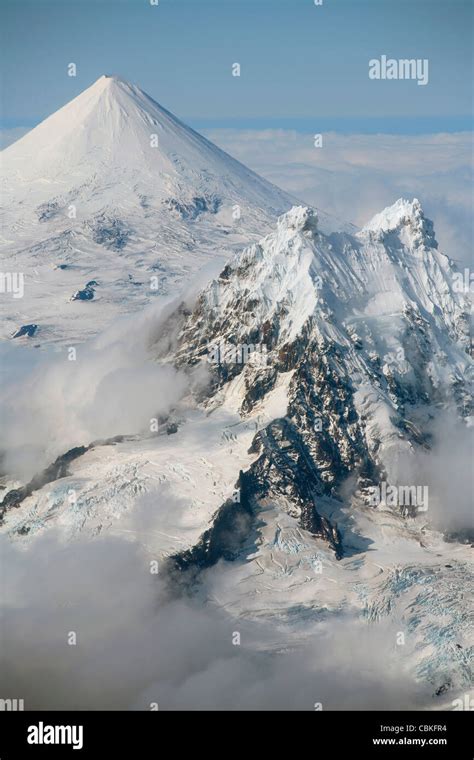 Aerial View Of Conical Snow Covered Shishaldin Volcano With Isanotski