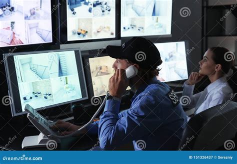 Security Guards Monitoring Modern Cctv Cameras In Surveillance Room