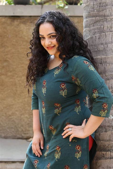 Actress Nithya Menon Latest Photoshoot Images In Green Dress Actress