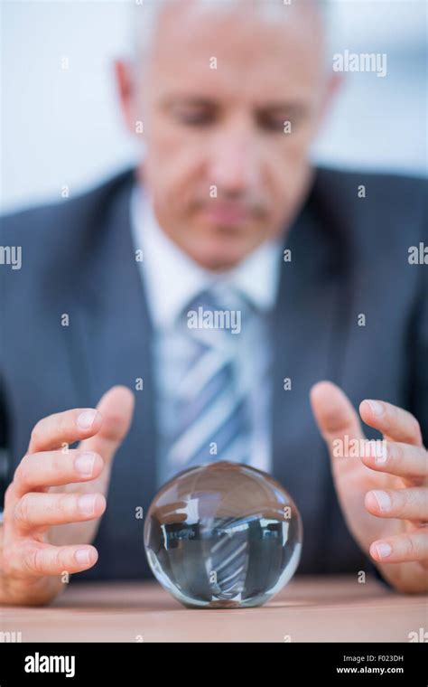 Businessman Forecasting A Crystal Ball Stock Photo Alamy