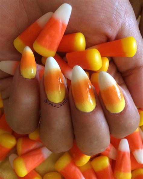 This design is so unique that it will surely add a glamorous sheen to your identity and make you stand out no matter. Love this over the top candy corn manicure for Halloween. | Halloween nails diy, Candy corn ...