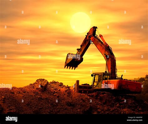 Excavator Loader Machine During Earthmoving Works Outdoors Stock Photo