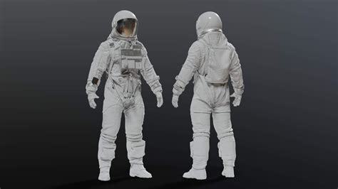 Two White Astronaut Suits Standing Next To Each Other