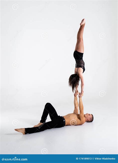 Duo Of Acrobats Showing Hand To Hand Trick On White Stock Image Image Of Women Performance