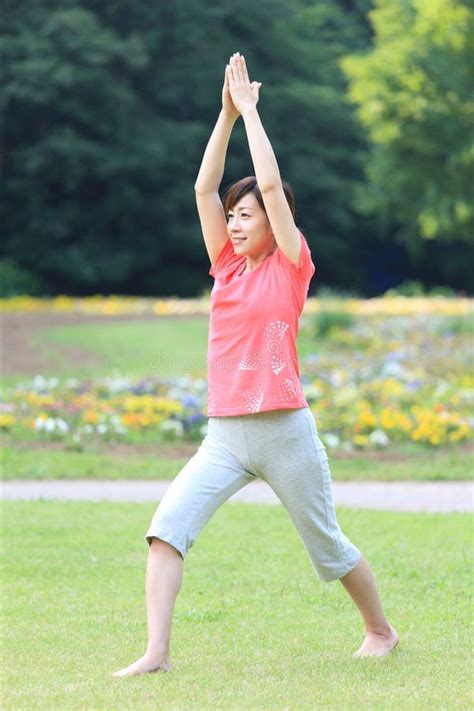 Japanese Woman Doing Yoga Warrior I Pose Stock Photos Free And Royalty
