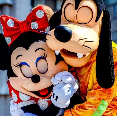 Minnie Gets A Hug From Goofy While Performing In The Dream Along With