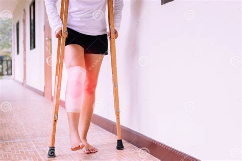 Woman Using Crutch And Broken Leg For Walking At Homeclose Up Stock
