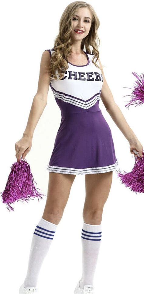 A Cheerleader Posing With Her Pom Poms