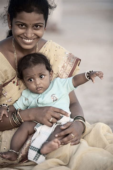 An Indian Mother And Child At Palolem Beach In The Evening Palolem