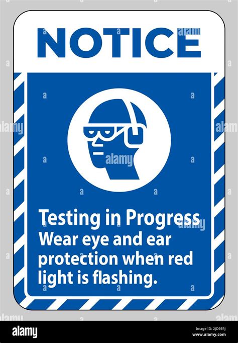 Notice Sign Testing In Progress Wear Eye And Ear Protection When Red Light Is Flashing Stock