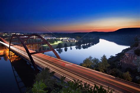 A Colorful Sunset Falls On The Austin Loop 360 Pennybacker Bridge As It