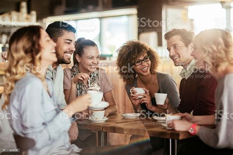 Photo Of Friends Having Coffee In Cafe Stock Photo - Download Image Now 