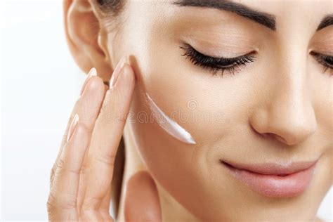 Beauty Closeup Happy Young Woman Apply Cream To Her Face Skincare And