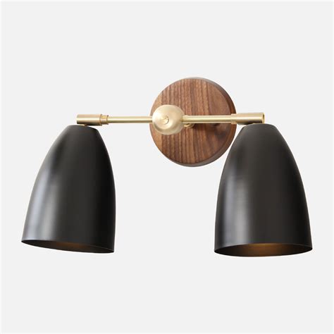 From curvy sconces to double bath fixtures, bathroom lighting is limited only by the imagination. Double Cavern Sconce | Sconces, Black vanity light, Vanity ...