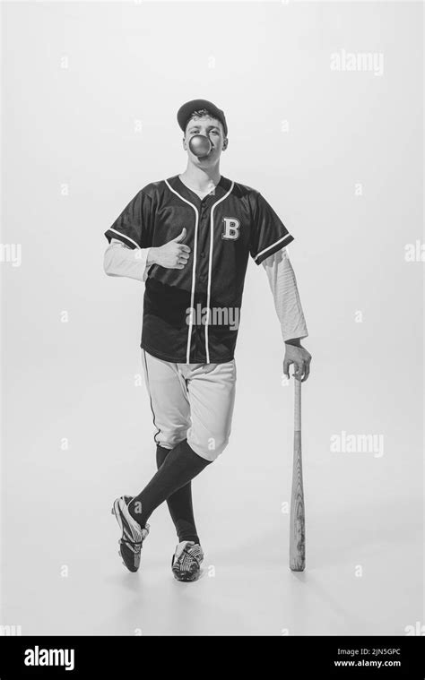Portrait Of Young Man Baseball Player Posing With Bubblegum And Bat