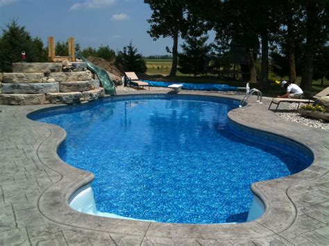 Picture slide show of building our pool this summer. Inground Pool with Slide | Inground pools, Pool ...
