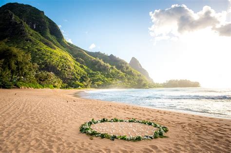 A uniquely designed exclusive coastal wedding venue accessed via a hand carved tunnel through the cliff & with its own private beach! Tunnels Beach Wedding - Ali'i Kaua'i Weddings