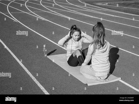 Healthy Children Girls Training Fitness On Stadium Running Track Sport