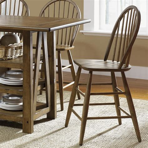 While counter height chairs with arms and backs can be more comfortable, backless stools go even further to create the feel of a home bar, encouraging guests to lean forward into the if you want to give the space a more formal feel, consider upholstered counter height chairs with supportive backs. Windsor Back Counter Height Chair by Liberty Furniture ...