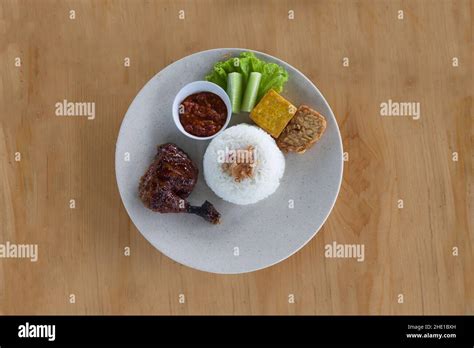 Pecel Ayam Or Ayam Penyet Is A Traditional Indonesian Fried Chicken