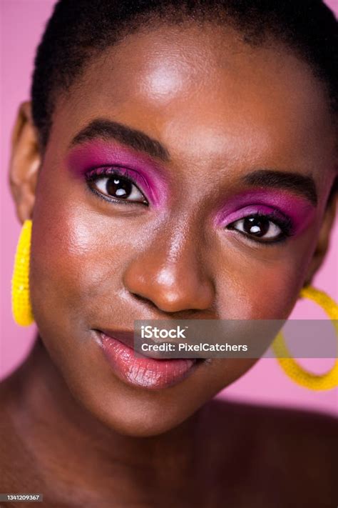 Portrait Young Woman With Head Tilted Glossy Pink Make Up Stock Photo