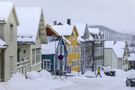 Historic Colourful Wooden Houses Bridge Heavy Snow In Winter Tromso
