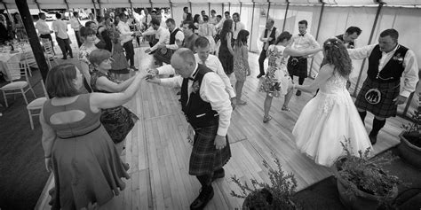 Scottish Ceilidh Dancing At The End Of A Celtic Themed Outdoor Garden