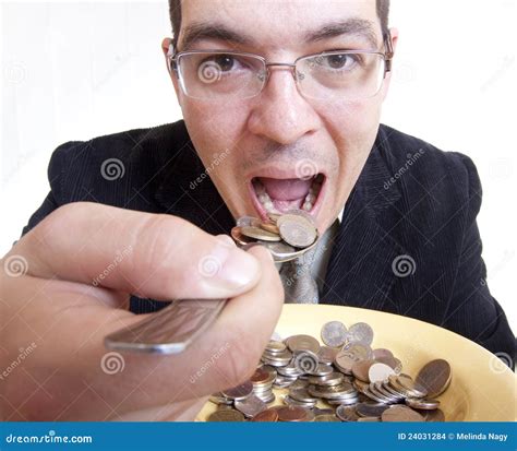 Hombre De Negocios Que Come El Dinero Foto De Archivo Imagen De Banca