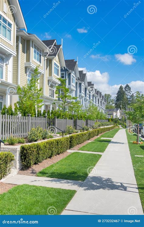 Paved Walkway In Front Of Residential Townhouses On A Bright Sunny Day