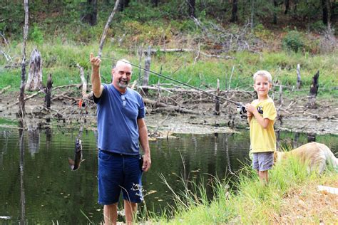 Little Boy And Grandfather Fishing Free Stock Photo Public Domain Pictures