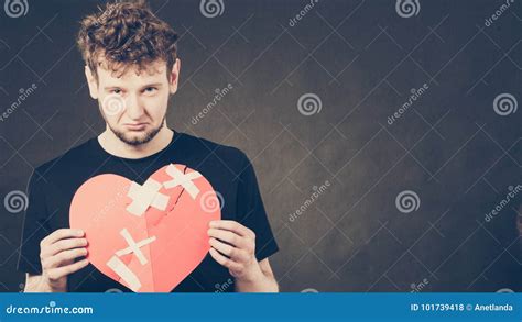 Sad Man With Glued Heart By Plaster Stock Photo