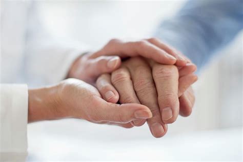 Female Doctor Holding Patient S Hand Photograph By Science Photo Library Fine Art America