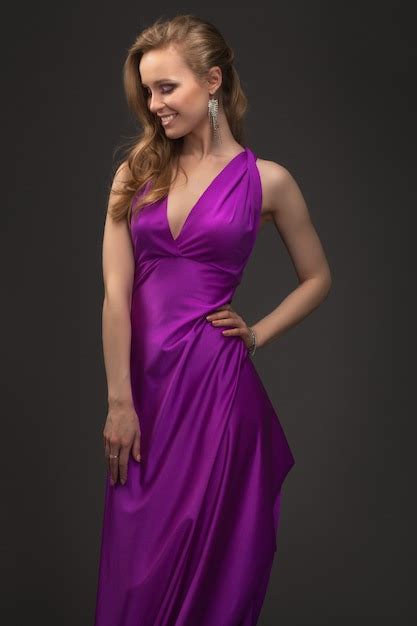 Premium Photo Alluring Sexy Girl In Evening Dress Posing Over Dark
