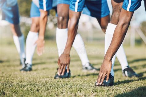 Man Soccer Players And Stretching Legs Before Sports Game Match Or